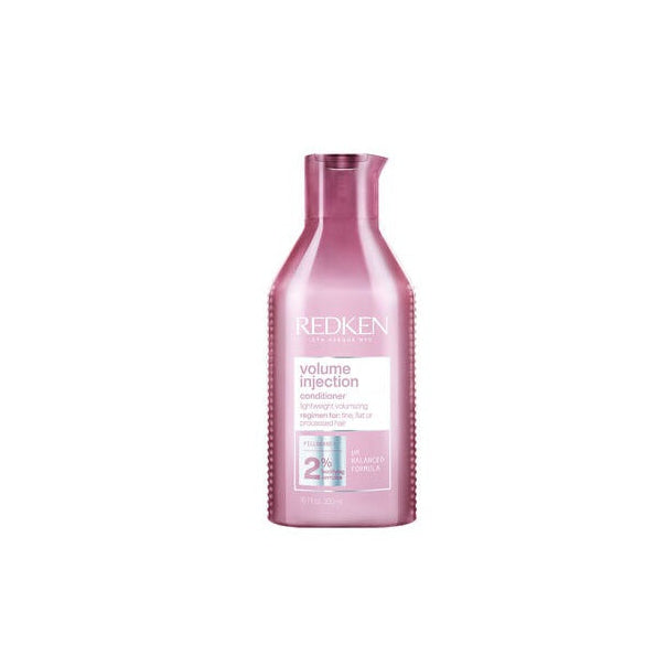 Redken bottle of shampoo on a white background