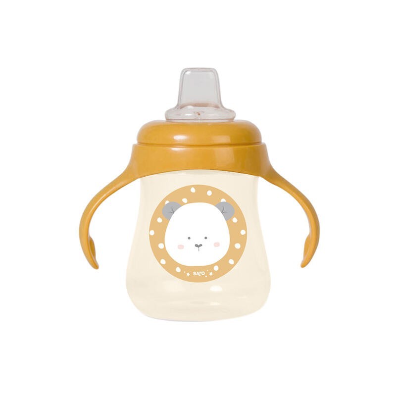 Baby bottle with yellow handle and bear face design on a white background